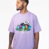 Remera oversize lila con estampa de dibujitos y palabra crew